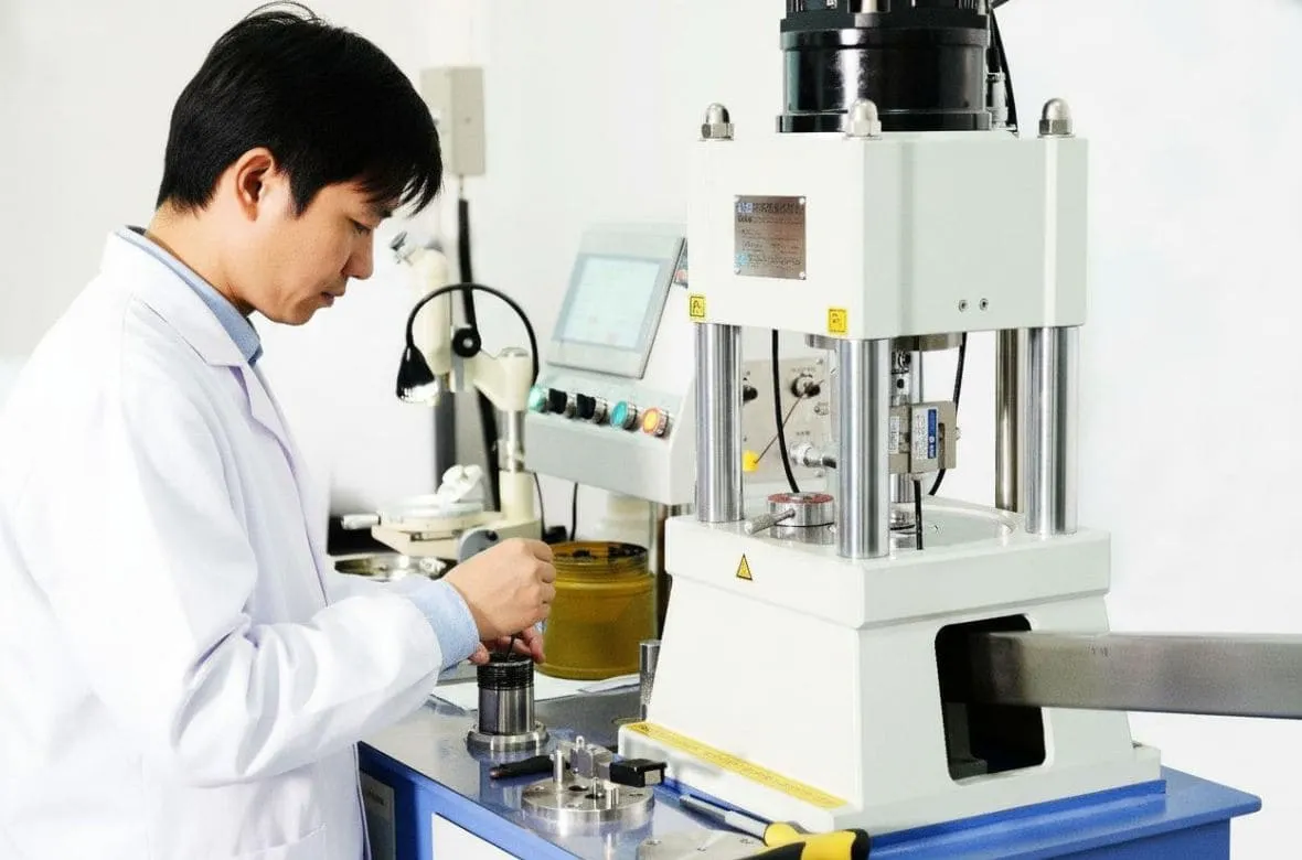 engineers are conducting a four ball friction experiment with lubricating grease.