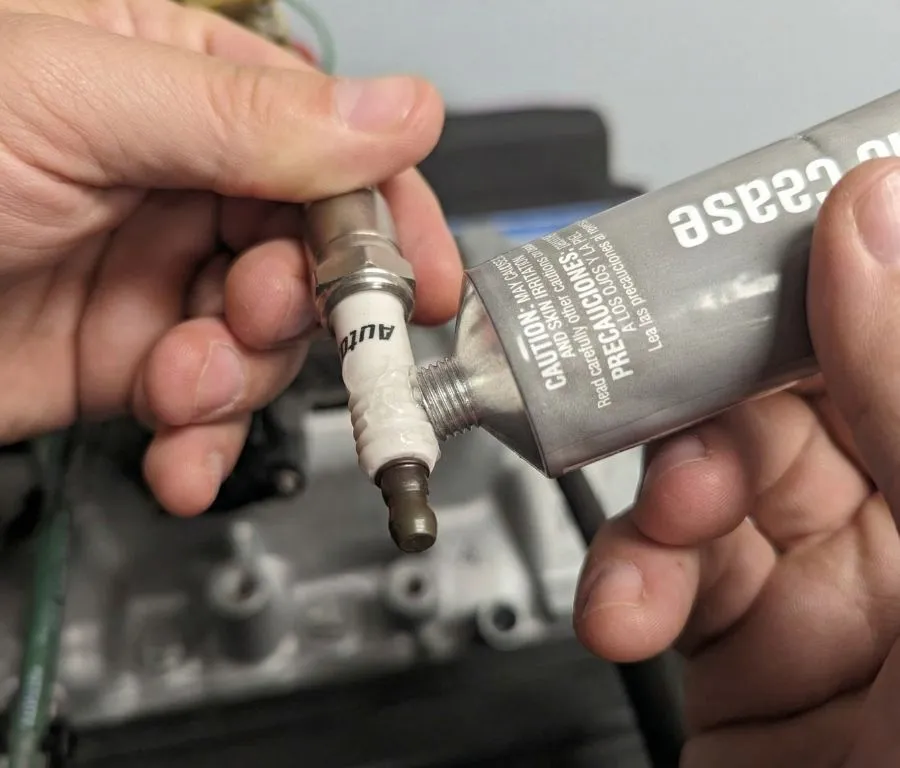 Dielectric grease for spark plug boot moisture sealing